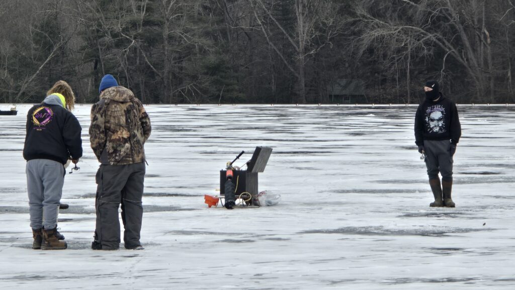 Image of people ice fishing (3) - for the Ultimate Guide to Frozen Laurel Lake in the Winter - Pine Grove Frunace State Park in Michaux State Forest - Awesome Carlisle! - Carlisle PA Guides and News