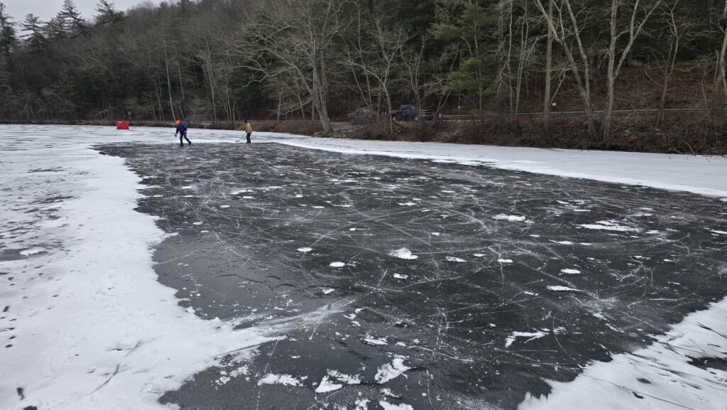 Image of a groomed and cleared area of the lake that's smooth and free of snow where they usually play hockey - for the Ultimate Guide to Frozen Laurel Lake in the Winter - Pine Grove Frunace State Park in Michaux State Forest - Awesome Carlisle! - Carlisle PA Guides and News