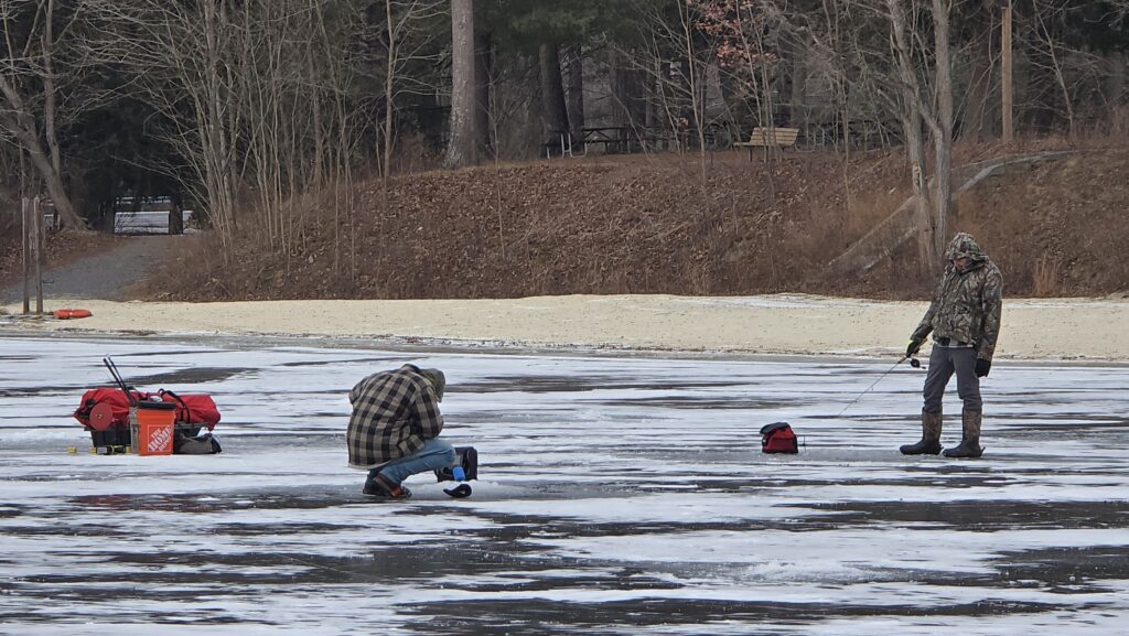 Image of people ice fishing - for the Ultimate Guide to Frozen Laurel Lake in the Winter - Pine Grove Frunace State Park in Michaux State Forest - Awesome Carlisle! - Carlisle PA Guides and News