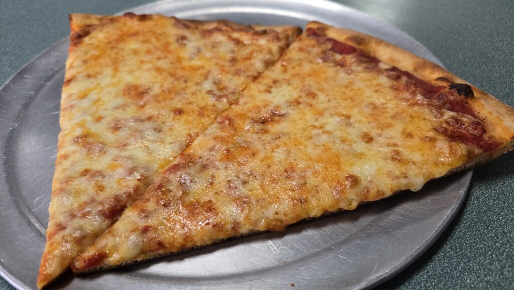 close up side angle view of 2 slices of plain cheese pizza at Miseno Pizza and Ristorante located at 1225 Ritner Hwy, Carlisle, PA 17013 - Review of of a Slice of Pizza at Miseno Pizza and Ristorante in Carlisle, PA