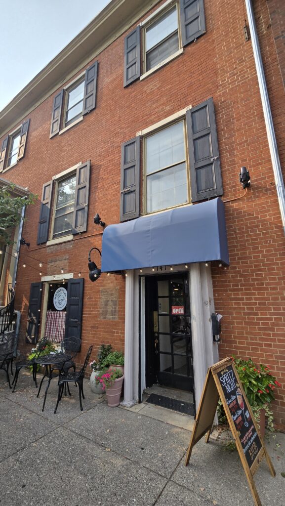 vertical front right angle view showing entire 3 stories of the building and sidewalk seating and tables at Nonna Ilva in Carlisle, PA - Carlisle, PA Pizza Reviews - Awesome Carlisle!