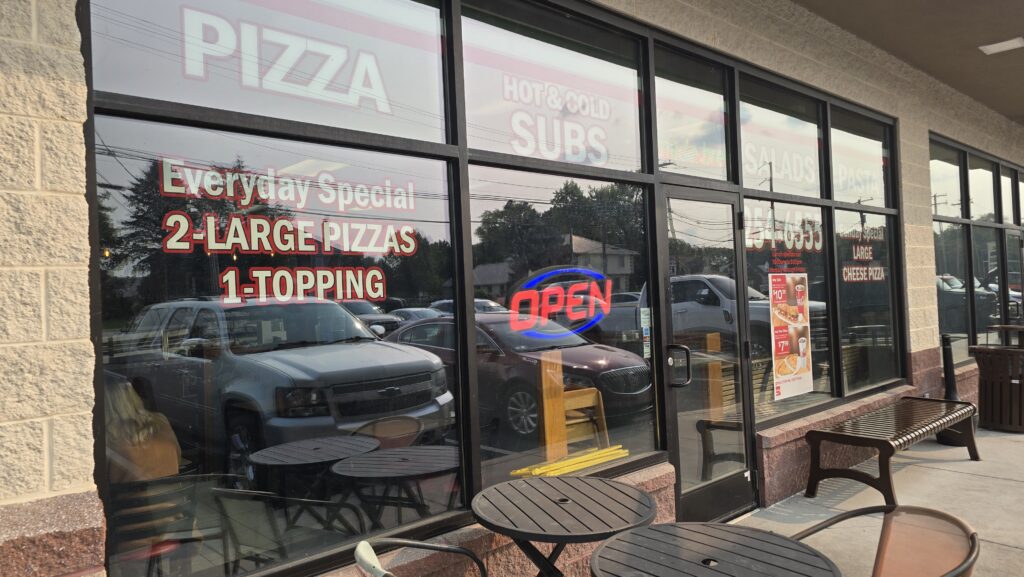 close up image of the exterior of the front windows and sidewalk seating at Napoli Pizza in Carlisle, PA - Carlisle, PA Pizza Reviews - Awesome Carlisle!
