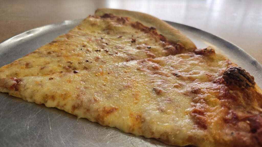 Close up low side view of two slices of pizza at Napolia Pizza in Carlisle, PA - Carlisle, PA Pizza Reviews - Awesome Carlisle!