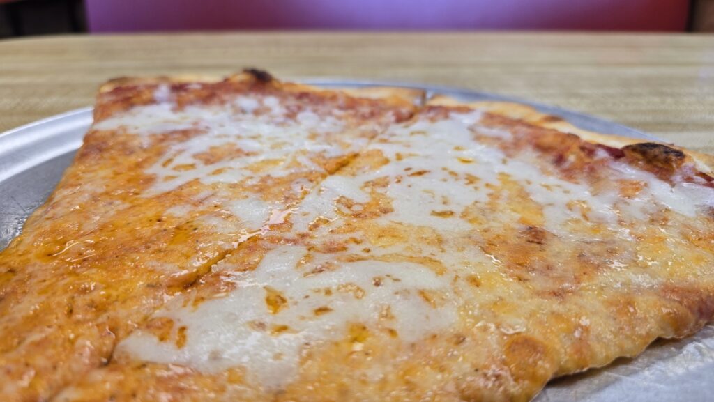 Close up low side view of two slices of pizza at Vinny Restaurant Pizza and Subs in Carlisle, PA - Carlisle, PA Pizza Reviews - Awesome Carlisle!