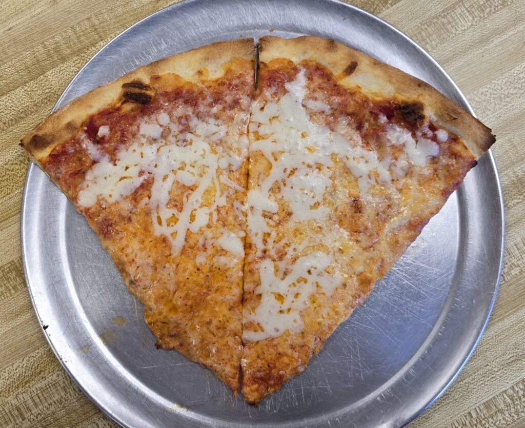 Overhead top down view of two slices of pizza at Vinny Restaurant Pizza and Subs in Carlisle, PA - Carlisle, PA Pizza Reviews - Awesome Carlisle!