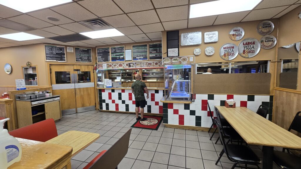 View of the ordering counter at Vinny Restaurant Pizza and Subs in Carlisle, PA taken from a table against the front window wall - Carlisle, PA Pizza Reviews - Awesome Carlisle!