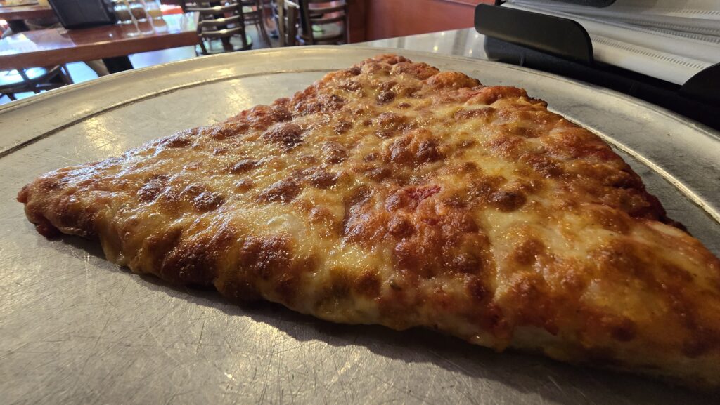 close up view of a plain slice of cheese pizza at george's subs and pizza for the article Review of a Slice of Pizza at George's Subs & Pizza in Carlisle, PA - awesome carlisle!